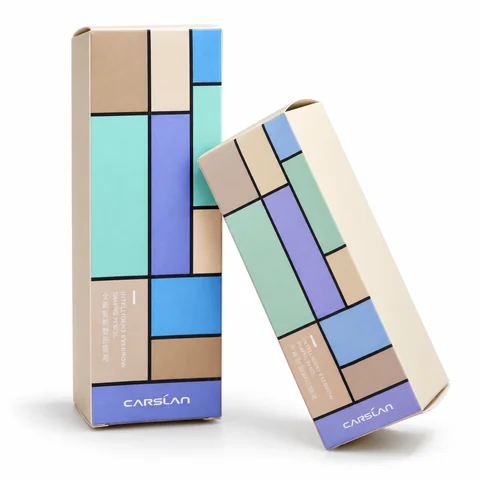 Two geometric printed folding cartons on white