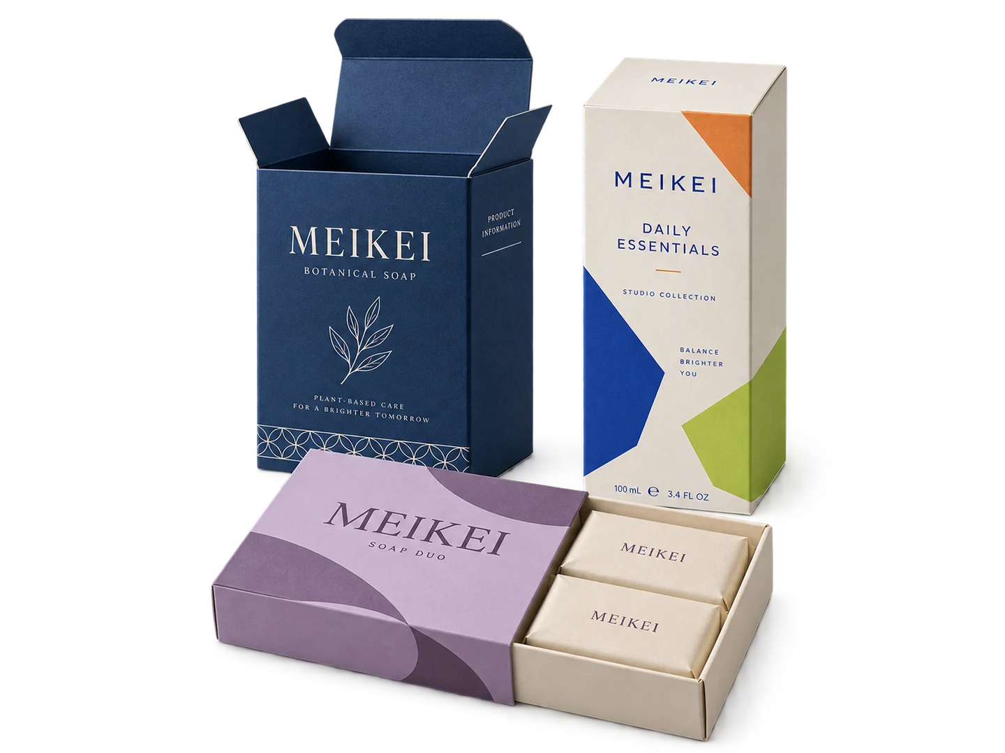 MEIKEI navy tuck-end carton, geometric retail carton and lilac sleeve-and-tray packaging on white