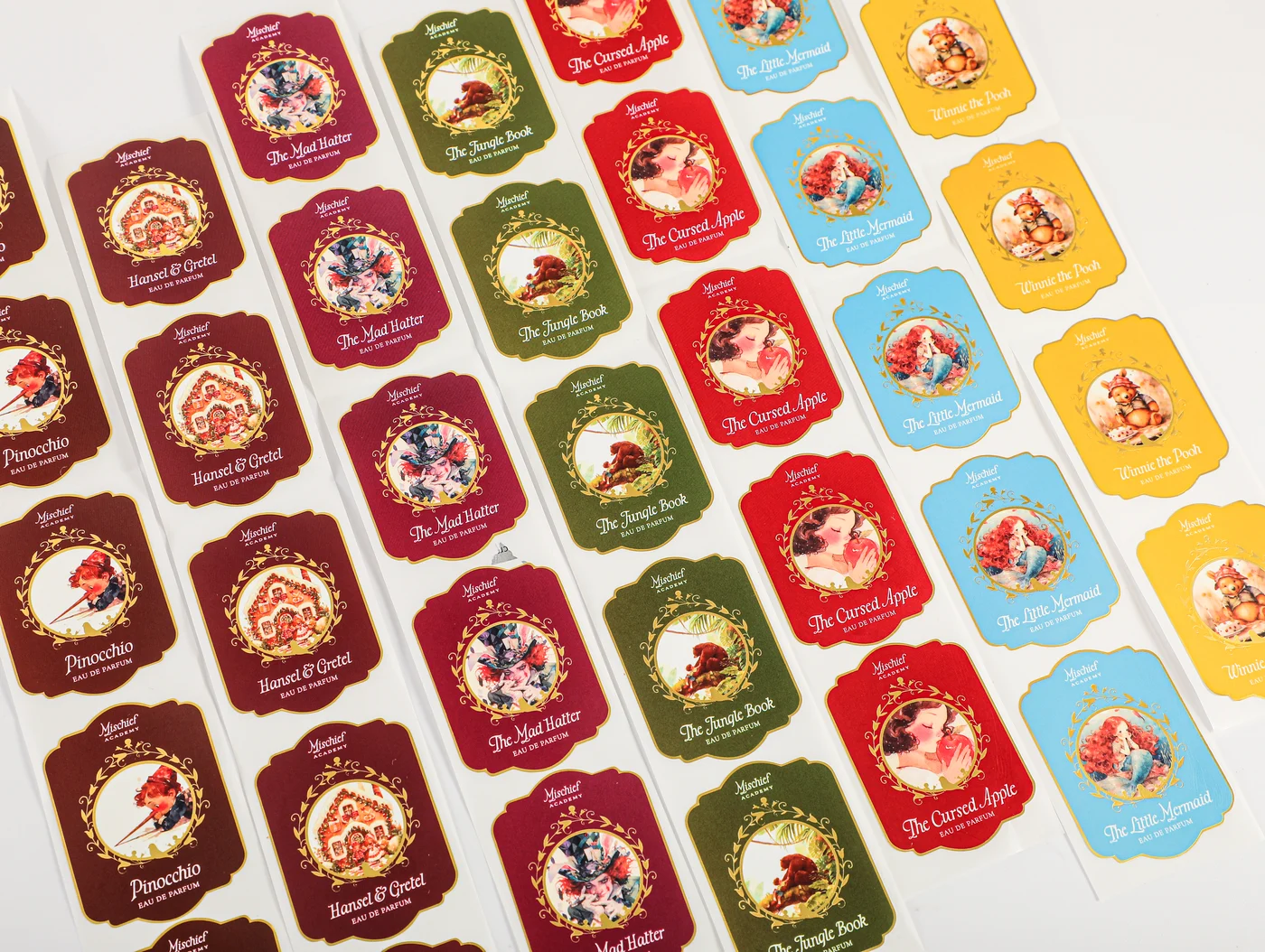 A selection of printed product labels with different artwork and typography